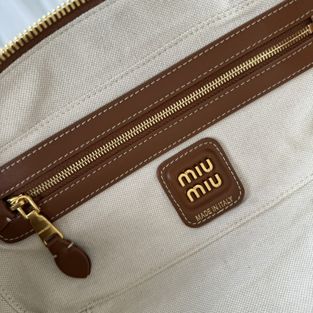 Miu Miu Beau canvas and leather bag 11.5x28x8cm