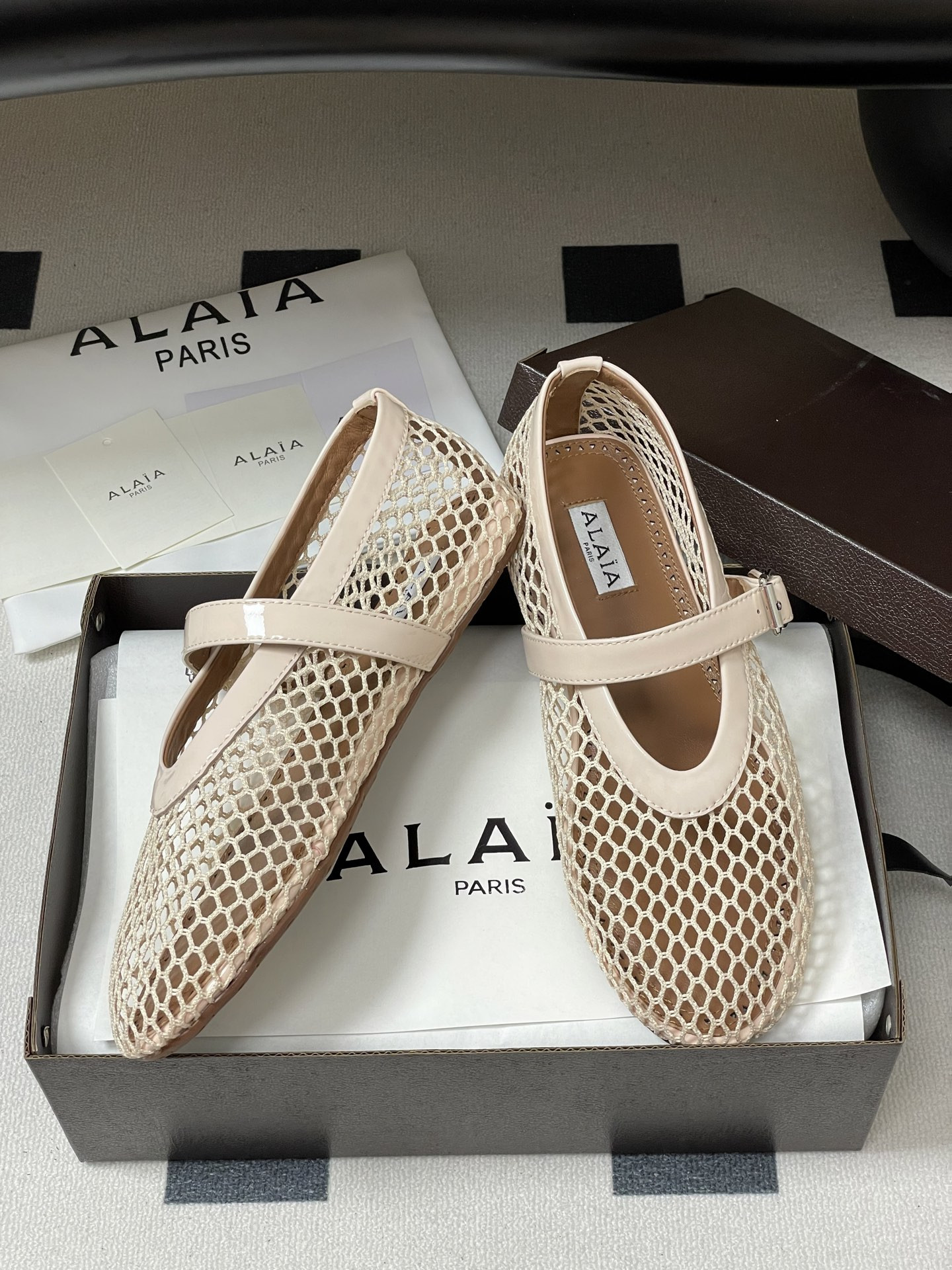UA ALAÏA BALLET FLATS IN FISHNET